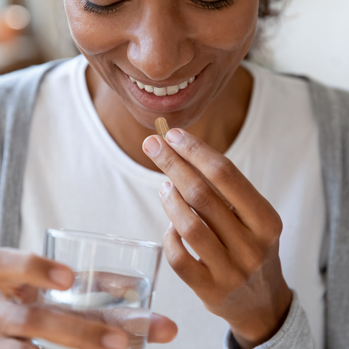 Woman taking Spectrum Antioxidant Supplement