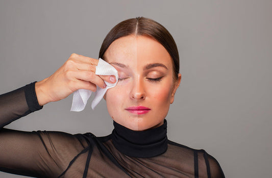 Woman wiping off eye makeup